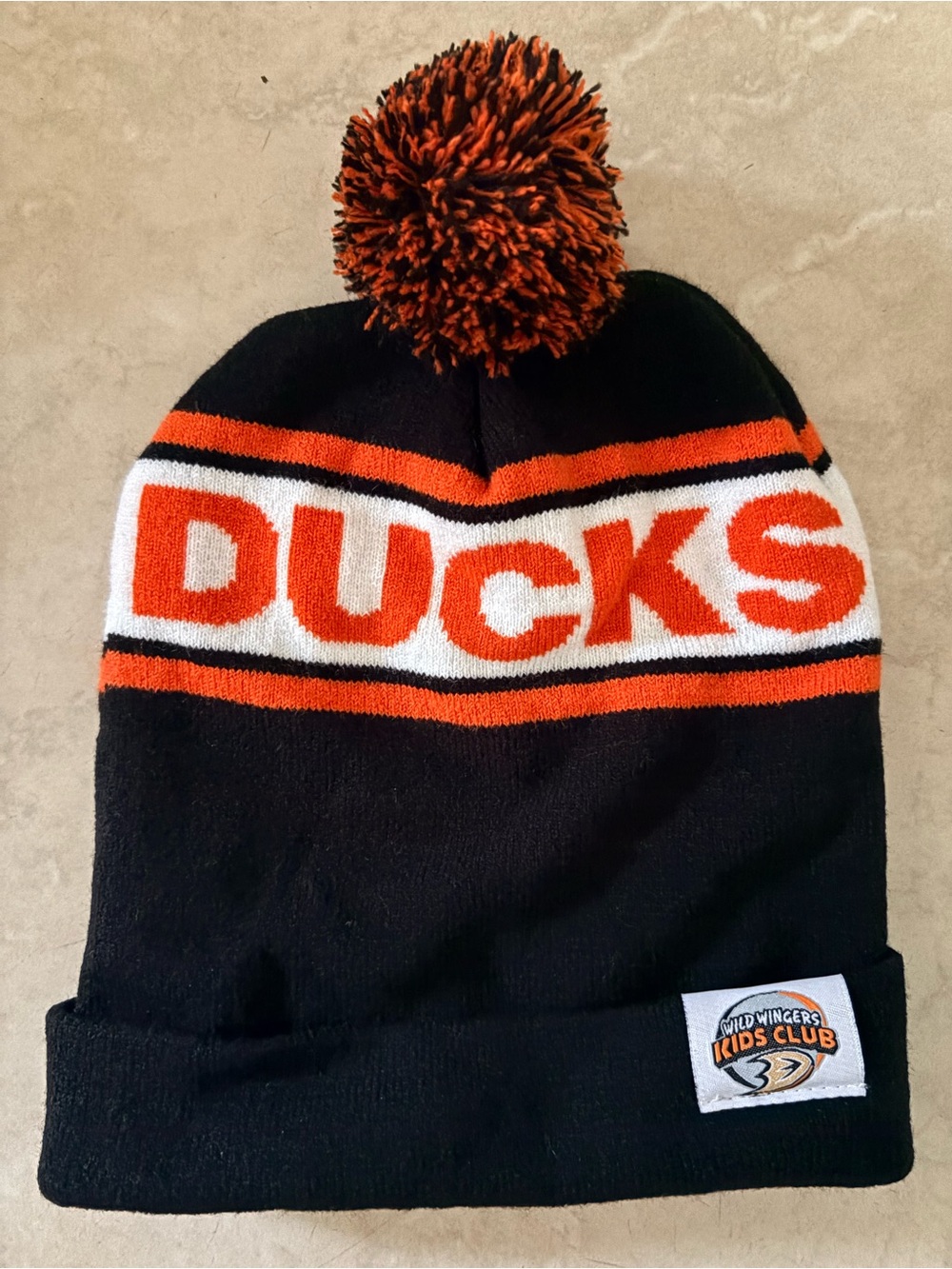 Kids 'Ducks' Pom Beanie Hat - Black & Orange